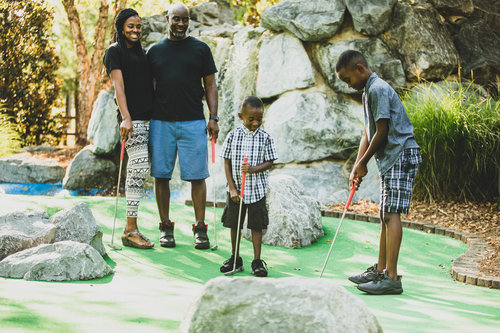 a group of people standing on a rock