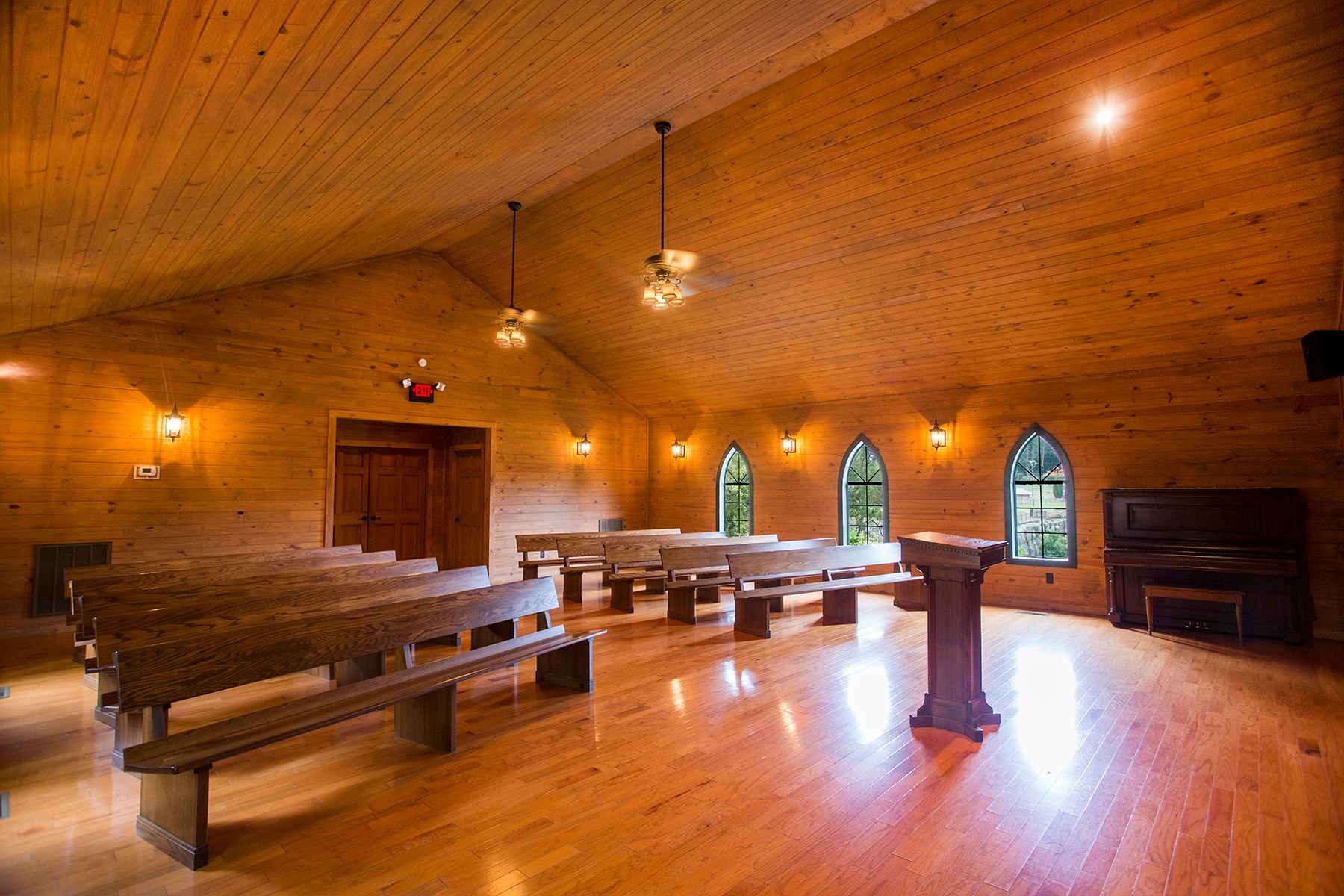 a room filled with furniture on top of a wooden table