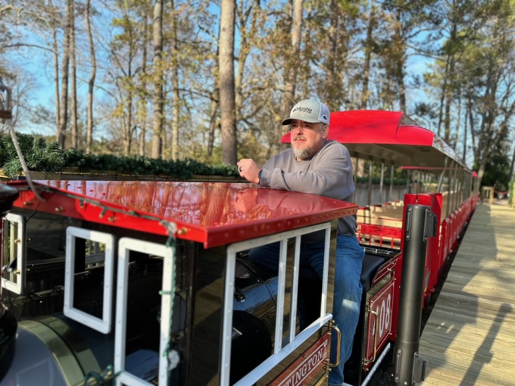 a man riding on the back of a train