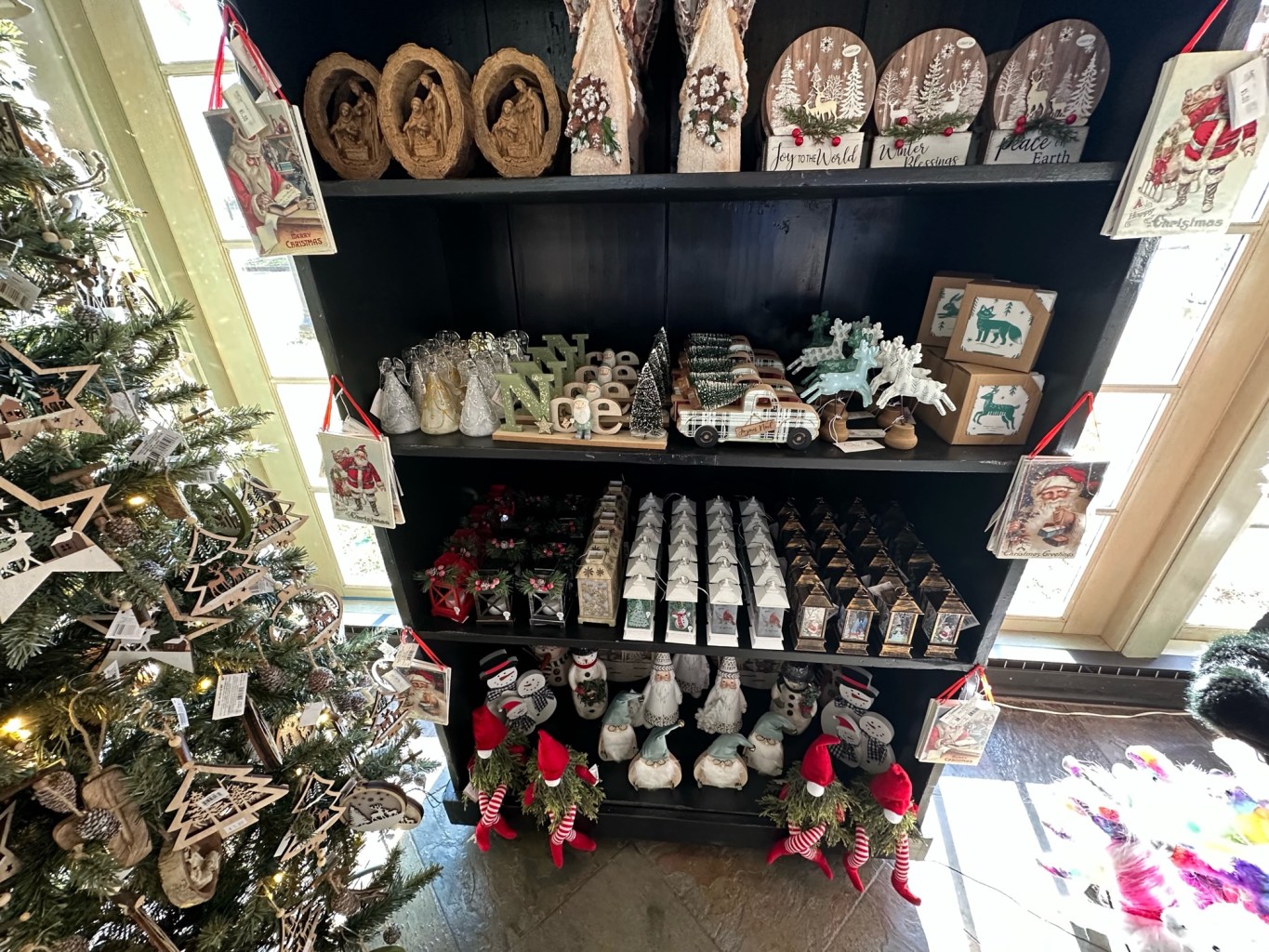 a bunch of stuffed animals on display in a store